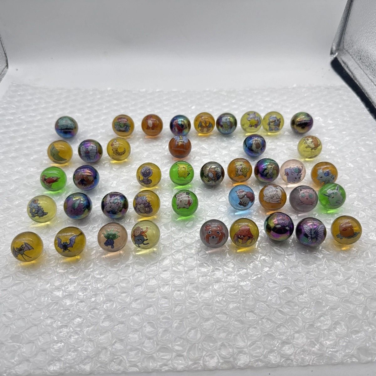 Mercancía oficial de Pokémon a - Vintage Collectible Marbles reseña y precio