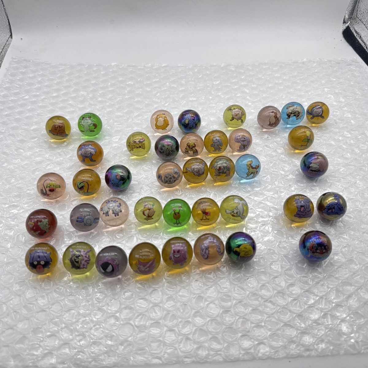 Mercancía oficial de Pokémon a - Vintage Collectible Marbles reseña y precio